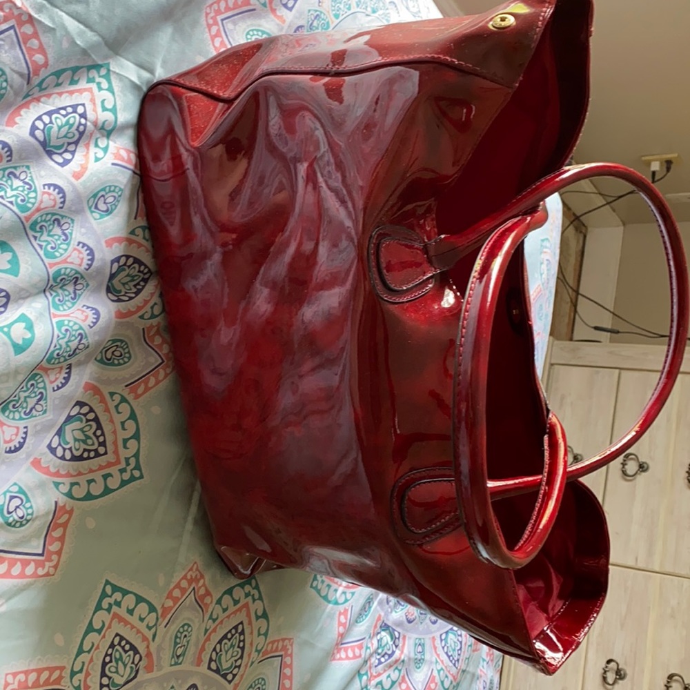 This really cute red purse that comes in need for many uses! Was 70 sell for 50